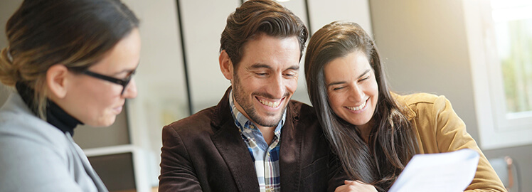 happy couple buying a house